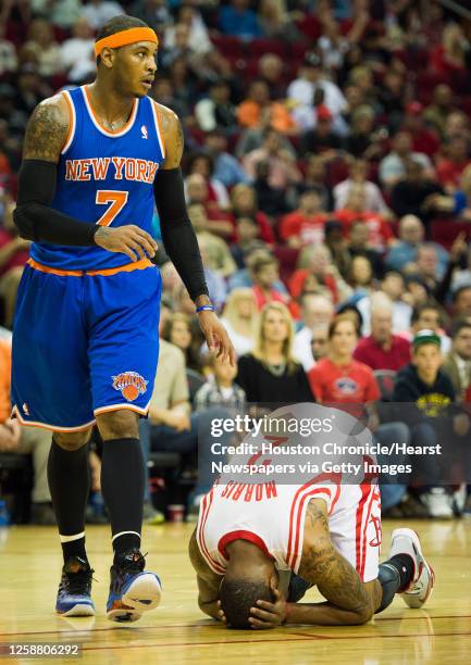 Houston Rockets power forward Marcus Morris collapse to the floor after being hit by an errant elbow as New York Knicks small forward Carmelo Anthony...