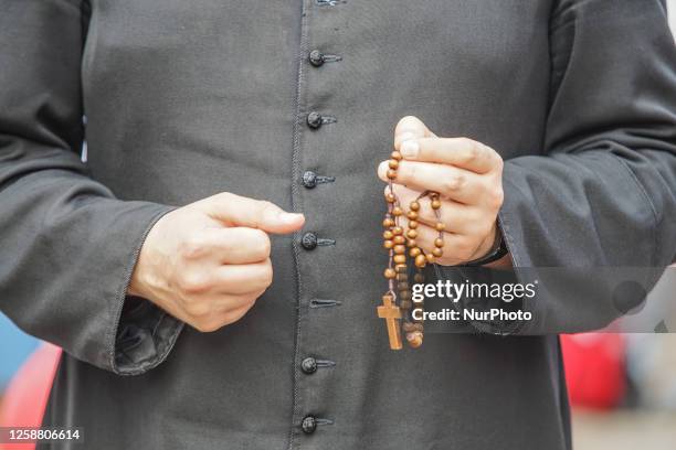 Catholic priest with rosary in hand is seen in Gdansk, Poland on 18 June 2023 Dozen people, mostly pensioners, took part in the so called National...