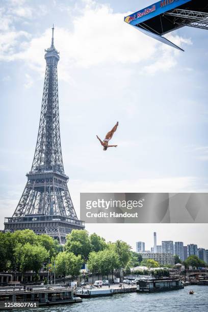 In this handout image provided by Red Bull, Madeleine Bayon of France dives from the 21.5 metre platform during the final competition day of the...