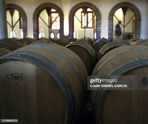 Barrels of wine beside the room while a luncheon was offered after Baroness Nadine de Rothschild and French businessman Laurent Dassault cut the...