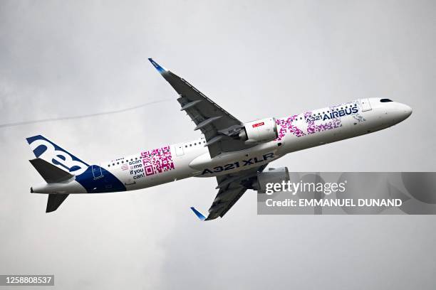 This photograph taken on June 19, 2023 shows a demonstration of the Airbus A321 XLR as French President visits the International Paris Air Show at...