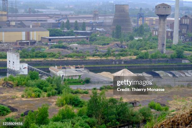 The Swiss-based global building materials and aggregates Holcim, the Sambre river and other factory are seen from 'Saint-Theodore Est' Spoil tip on...