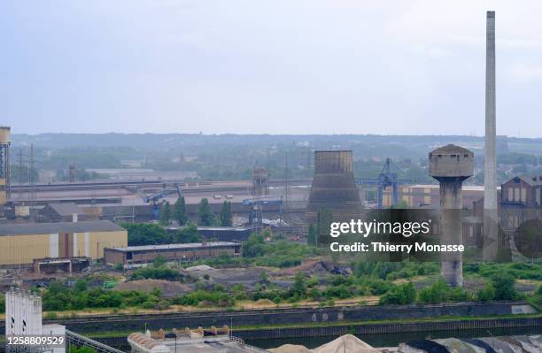 The Swiss-based global building materials and aggregates Holcim, the Sambre river and other factory are seen from 'Saint-Theodore Est' Spoil tip on...