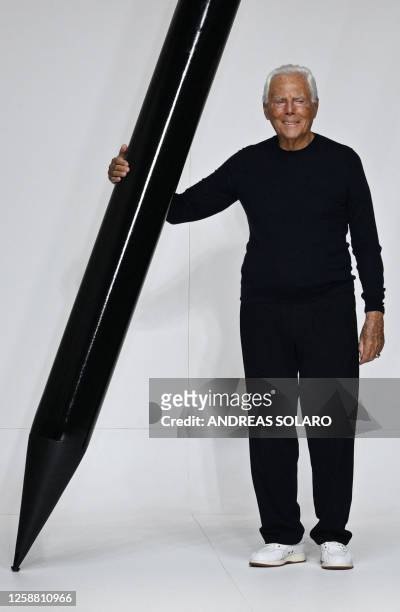 Italian fashion designer Giorgio Armani acknowledges the audience at the end of the Armani Men's Spring - Summer 2024 fashion show as part of the...