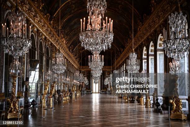 This picture shows the Galerie des Glaces in the Chateau de Versailles, in Versailles, west of Paris, on June 19, 2023.