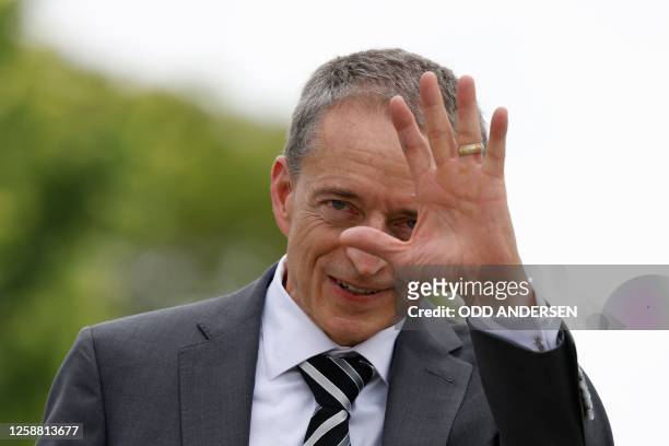 Pat Gelsinger, CEO of US multinational corporation and technology company Intel, waves to journalists after the signing of an agreement between the...