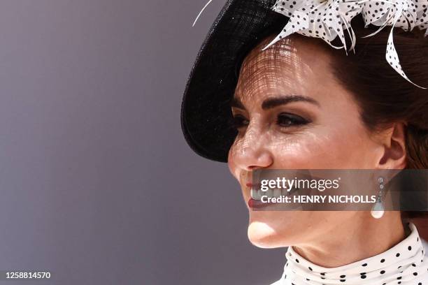 Britain's Catherine, Princess of Wales reacts as she arrives at St George's Chapel to attend the Most Noble Order of the Garter Ceremony in Windsor...