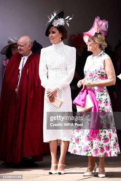 Catherine, Princess of Wales and Sophie, Duchess of Edinburgh react as they arrive at St George's Chapel to attend the Order Of The Garter Service at...