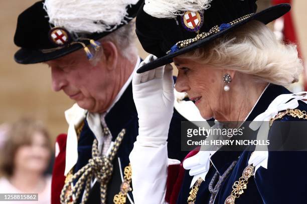 Britain's King Charles III and Britain's Queen Camilla arrive at St George's Chapel to attend the Most Noble Order of the Garter Ceremony in Windsor...
