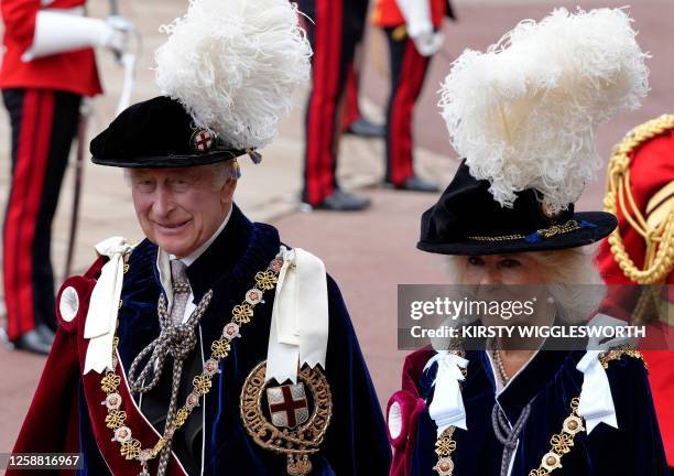 Britain's King Charles III and Britain's Queen Camilla arrive at St George's Chapel to attend the Most Noble Order of the Garter Ceremony in Windsor...