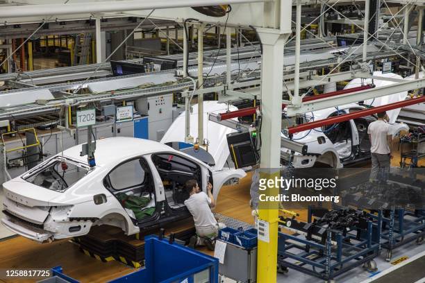Workers assemble Skoda vehicles on the production line at the Skoda Auto AS manufacturing plant in Mlada Boleslav, Czech Republic, on Monday, June...