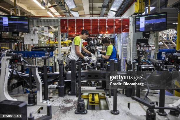 An engineer works on an engine on the production line at the Skoda Auto AS manufacturing plant in Mlada Boleslav, Czech Republic, on Monday, June 19,...