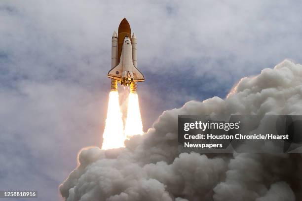 The space shuttle Atlantis launches for the STS-135 mission to the International Space Station in the final mission of the space shuttle program at...