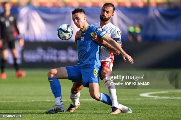 Malta's forward Kyrian Nwoko and Ukraine's defender Serhiy Kryvtsov vie for the ball during the UEFA Euro 2024 group C qualification football match...