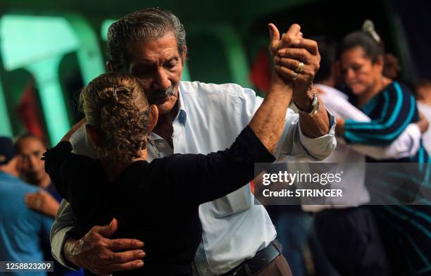 An elderly couple dances at the cultural tourism center El Ateneo de Nicaragua in Managua on June 18, 2023. Founded in 1996, El Ateneo Club is a...