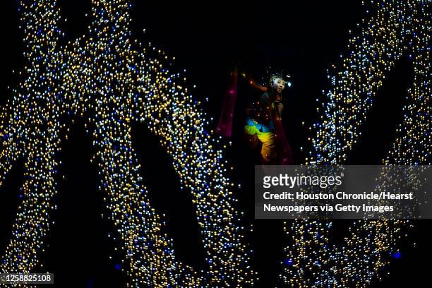 Performers portray fairies falling from the sky as the are suspended from wires during opening ceremonies for the 2008 Summer Olympic Games, Friday,...