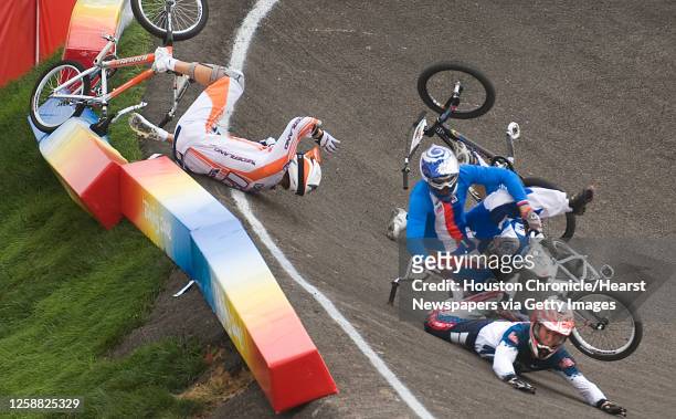 Kyle Bennett of Conroe, Texas, slides to the track, at bottom right, after crashing over Raymon van der Biezen of The Netherlands during the...