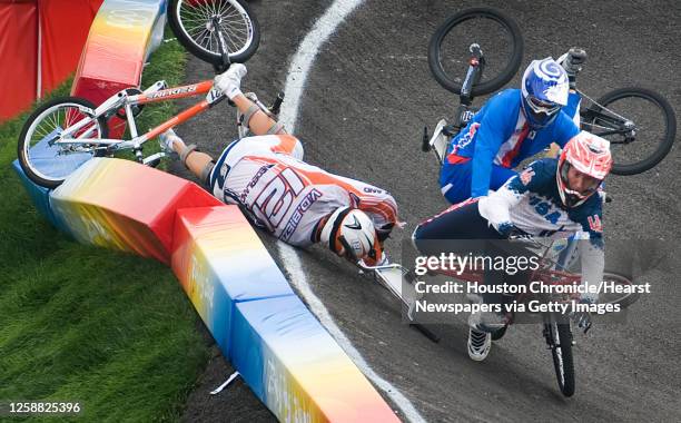 Kyle Bennett of Conroe, Texas, tumbles over Raymon van der Biezen of The Netherlands who crashed right in front of Bennett on a turn during the...
