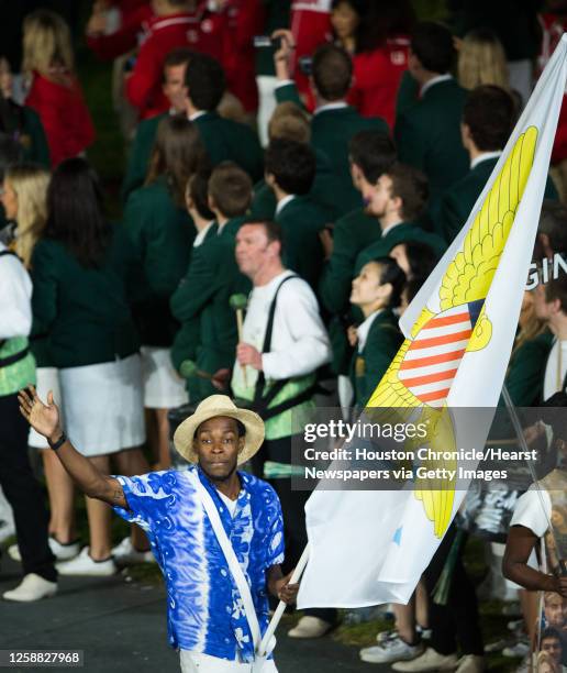 Texas A&M track athlete Tabarie Henry carries the flag of the U.S. Virgin Islands during the opening ceremony for the 2012 London Olympics on Friday,...