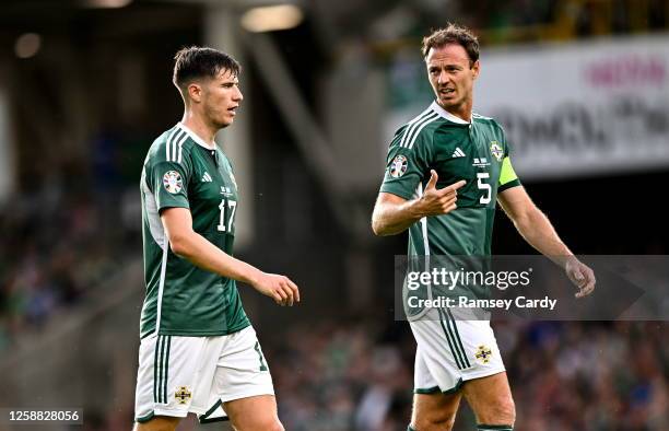 Belfast , United Kingdom - 19 June 2023; Paddy McNair, left, and Jonny Evans of Northern Ireland during the UEFA EURO 2024 Championship Qualifier...