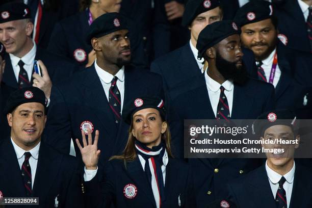 From left, Jean, Diana and Steven Lopez march with Team USA as they enter the stadium during the opening ceremony for the 2012 London Olympics on...