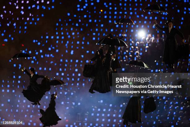 Performers fly through the stadium during the opening ceremony for the 2012 London Olympics on Friday, July 27, 2012.