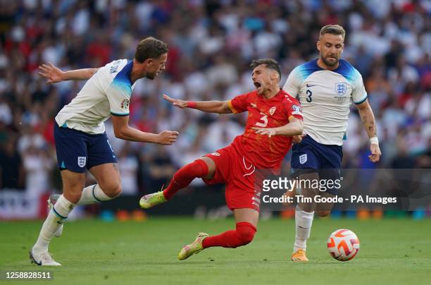 North Macedonia's Stefan Askovski reacts after a challenge by England's Jordan Henderson during the UEFA Euro 2024 Qualifying Group C match at Old...