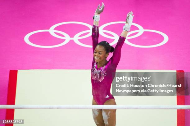 Gymnast Gabrielle Douglas performs on the uneven bars during the women's gymnastics individual all-around final at the 2012 London Olympics on...