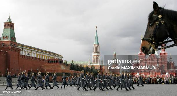 Russian soldiers from the Presidential regiment perform during the ceremonial show marking the end of a touristic season at the Red Square outside...