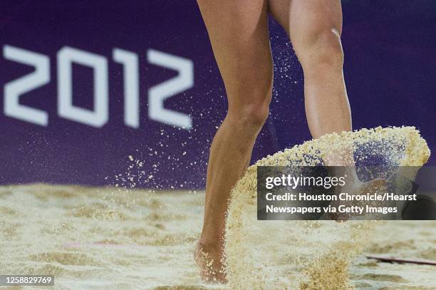 April Ross kicks up sand during the women's beach volleyball gold medal match at the 2012 London Olympics on Wednesday, Aug. 8, 2012.