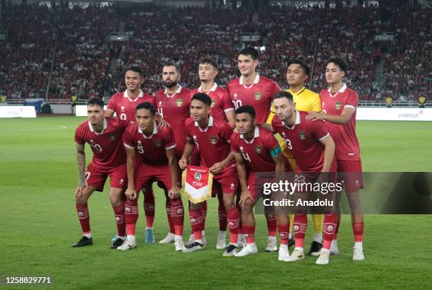 Indonesian players pose for a photo team during a friendly soccer match between Indonesia and Argentina at Gelora Bung Karno Stadium in Jakarta,...