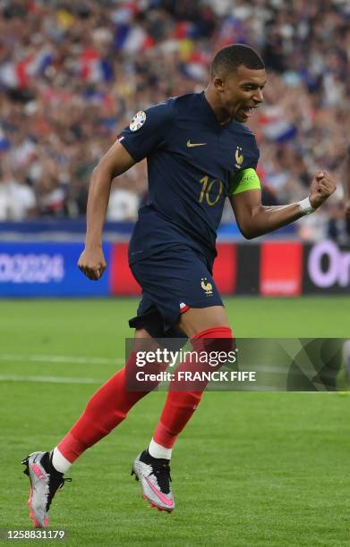 France's forward Kylian Mbappe celebrates after scoring the team's first goal during the UEFA Euro 2024 group B qualification football match between...