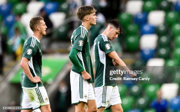 Belfast , United Kingdom - 19 June 2023; Northern Ireland players, from left, George Saville, Isaac Price and Paddy McNair after their side's defeat...