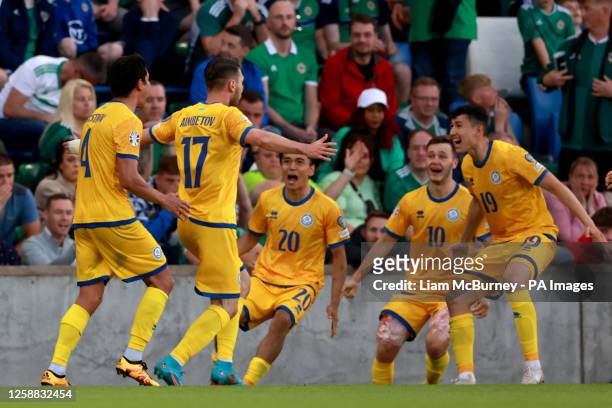 Kazakhstan's Abat Aimbetov celebrates scoring the opening goal with his team mates during the UEFA Euro 2024 Qualifying Group H match at the National...