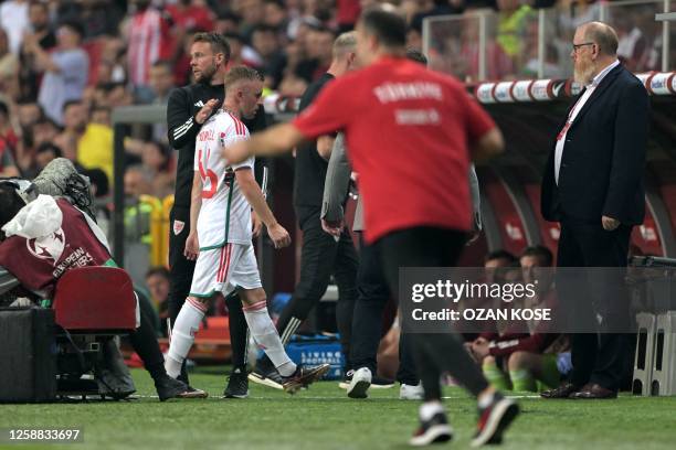 Wales' midfielder Joe Morrell walks off the pitch after receiving a red card during the UEFA Euro 2024 qualifier group D football match between...