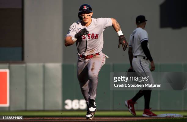Jarren Duran of the Boston Red Sox takes third base on a sacrifice fly to right field off the bat of Alex Verdugo in the first inning against the...
