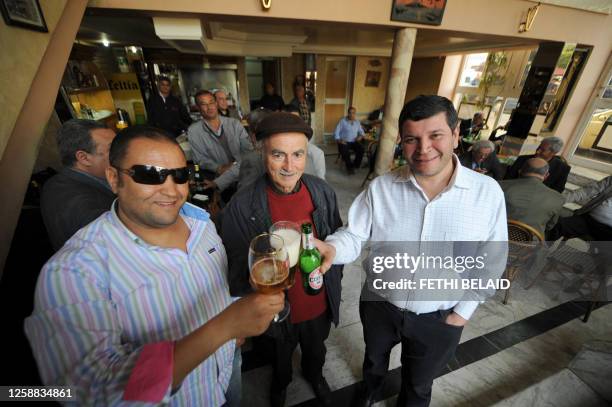 People drink beer in Palace bar at Habib Bourguiba Avenue in Tunis's inner-city - home to many vibrant bars, cafes, retaurants, boutiques and shops...