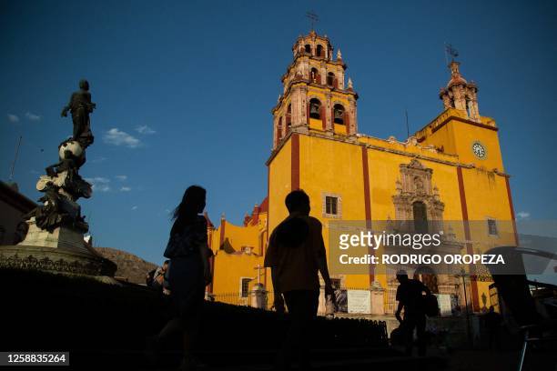 Tourists walk in the streets of Guanajuato City, Mexico, on June 5, 2023. The mummies of Guanajuato are distributed in three museums in this...