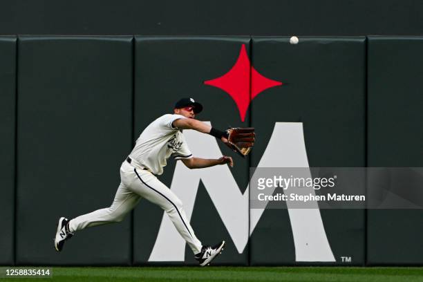 Alex Kirilloff of the Minnesota Twins tracks a fly ball for an out in the first inning against the Boston Red Sox at Target Field on June 19, 2023 in...