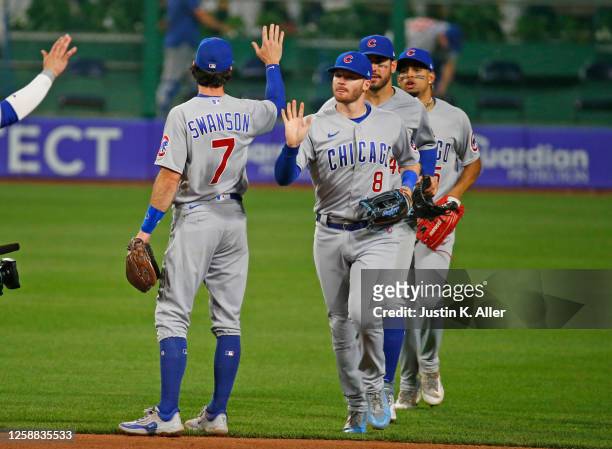 Ian Happ of the Chicago Cubs celebrates with teammates after defeating the Pittsburgh Pirates 8-0 at PNC Park on June 19, 2023 in Pittsburgh,...