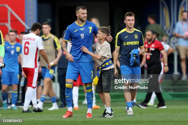 Andriy Yarmolenko of Ukraine greets a young fan after the UEFA EURO 2024 European qualifying soccer match between Ukraine and Malta at the Stadion...