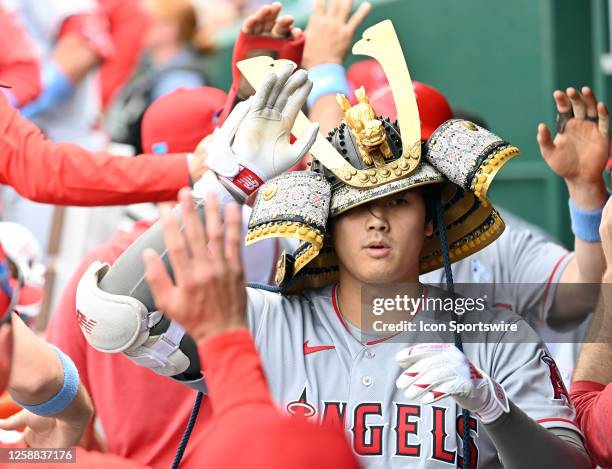 Los Angeles Angels designated hitter Shohei Ohtani wars the team's Samurai Hat after hitting a two-run home run during a MLB game between the Los...