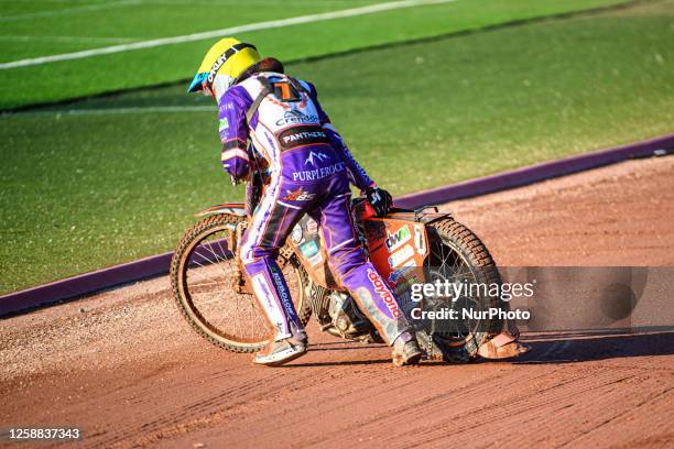 Jordan Jenkins pulls his bike from the track after shedding his chain and jamming the back wheel during the Sports Insure Premiership match between...