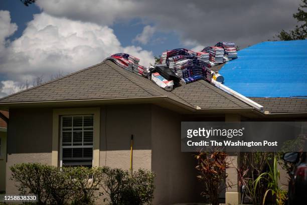 Materials on a roof that was damaged nearly nine months ago during Hurricane Ian in the Orlovista neighborhood of Orlando, Fla. On Thursday, June 8,...