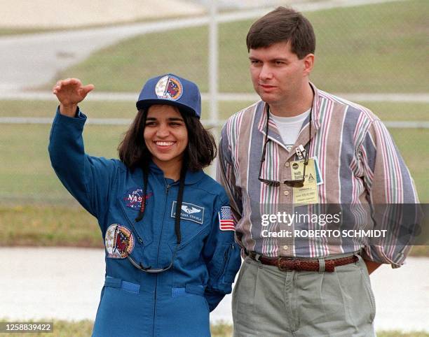 Indian-American astronaut Kalpana Chawla waves to well wishers and family members during a photo opportunity in the perimeter of launch pad 39-B at...