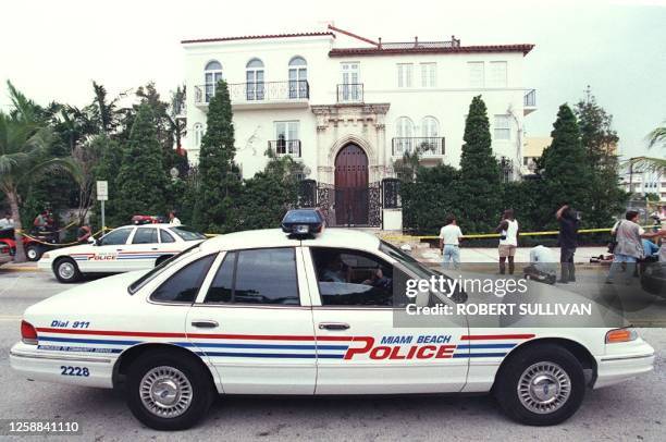 Miami Beach police car sits in front of the house owned by Italian fashion designer Gianni Versace where he was shot and killed 15 July in Miami...