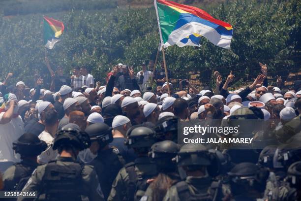 Israeli security forces deploy to disperse a protest by members of the local community near the Druze village of Majdal Shams in the Israel-annexed...