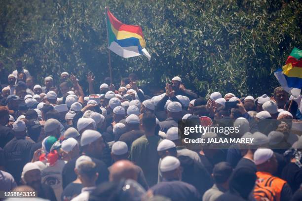 Members of the local community rally near the Druze village of Majdal Shams in the Israel-annexed Golan Heights, on June 20 to protest an Israeli...