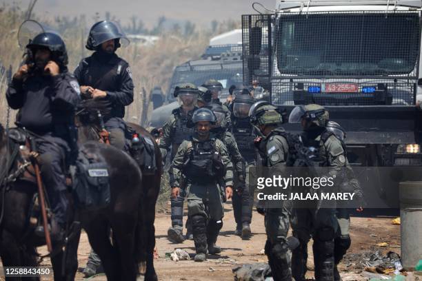 Israeli security forces deploy to disperse a protest by members of the local community near the Druze village of Majdal Shams in the Israel-annexed...