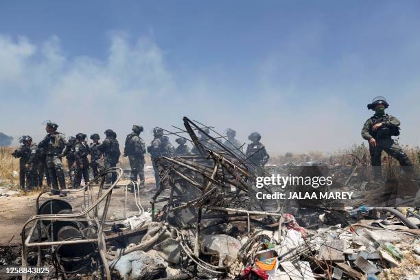 Israeli security forces deploy to disperse a protest by members of the local community near the Druze village of Majdal Shams in the Israel-annexed...